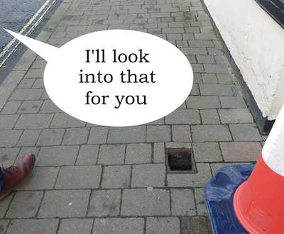 Hole in pavement with speech bubble